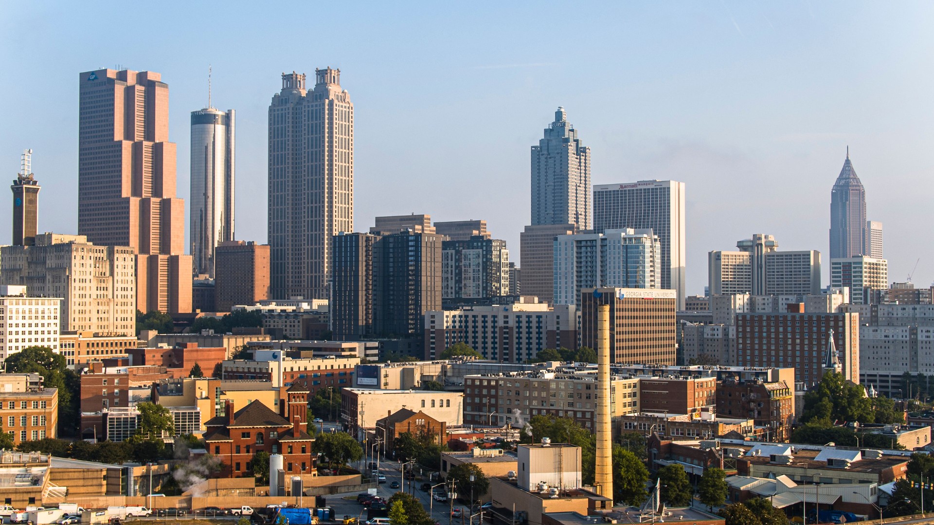 Sunny cityscape of Atlanta, GA business district: financial and business skyscrapers tower make skyline